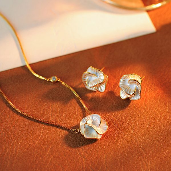 Korean version of the new drop glaze camellia zircon earrings French niche temperament earrings light luxury high-end earrings wholesale