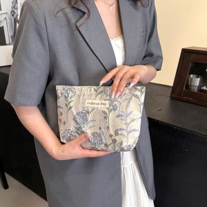 INS cream embroidery flower premium sense makeup bag large capacity water milk storage bag women's makeup portable clutch