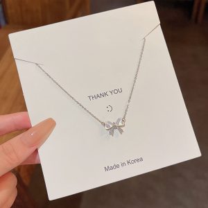 Light luxury niche cat's eye stone bow necklace female ins tide super fairy all-match temperament small fresh titanium steel clavicle chain