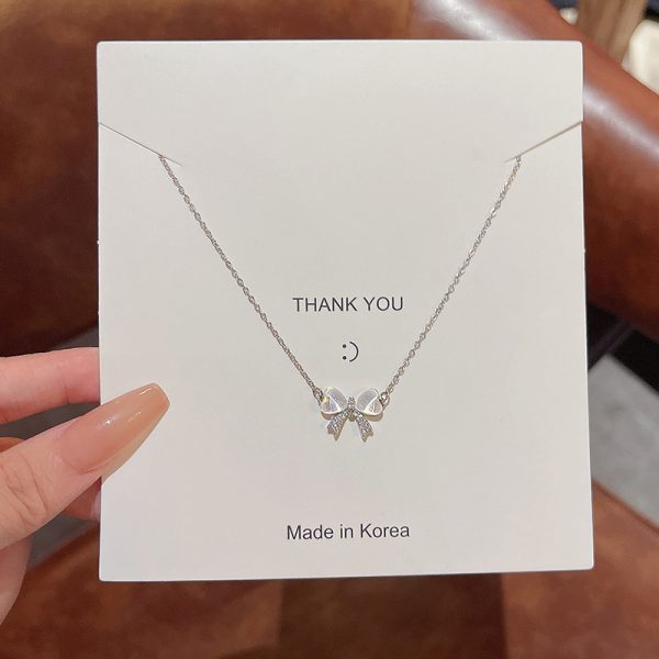 Light luxury niche cat's eye stone bow necklace female ins tide super fairy all-match temperament small fresh titanium steel clavicle chain