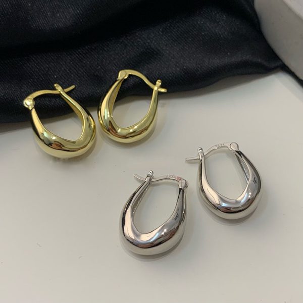 S925 silver needle earrings women's simple and cold style white earrings European and American metal photosensitive surface ear buckles daily French earrings