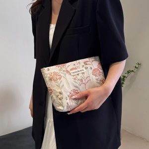 INS cream embroidery flower premium sense makeup bag large capacity water milk storage bag women's makeup portable clutch