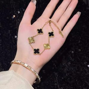 Black gold four-leaf clover bracelet women's light luxury niche delicate snake sparkling diamond flower bracelet luxury sense 2024 new style