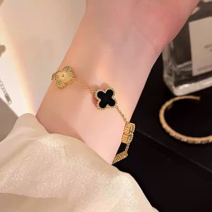 Black gold four-leaf clover bracelet women's light luxury niche delicate snake sparkling diamond flower bracelet luxury sense 2024 new style