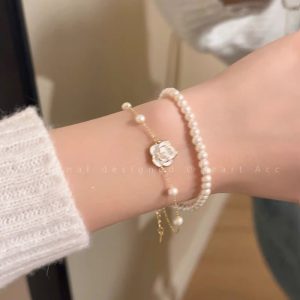 Camellia double-layered pearl bracelet for girls, light luxury, niche delicate hand ornaments, elegant temperament, high-end accessories