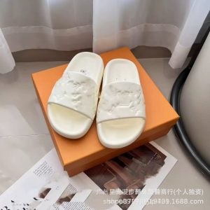 Foreign trade L home new letter embossed slippers men's 2024 spring and summer flat-bottomed top layer cowhide versatile slippers women